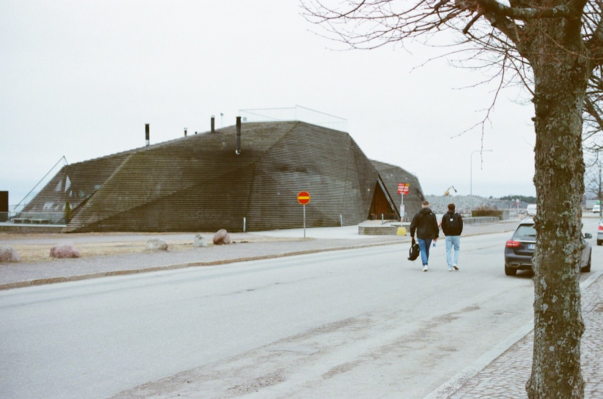 Myles and Alex in front of a sauna